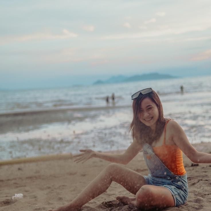 Avery Chen, Lead Design Curator at Bloom Crest Quilt, reviewing corporate floral arrangements